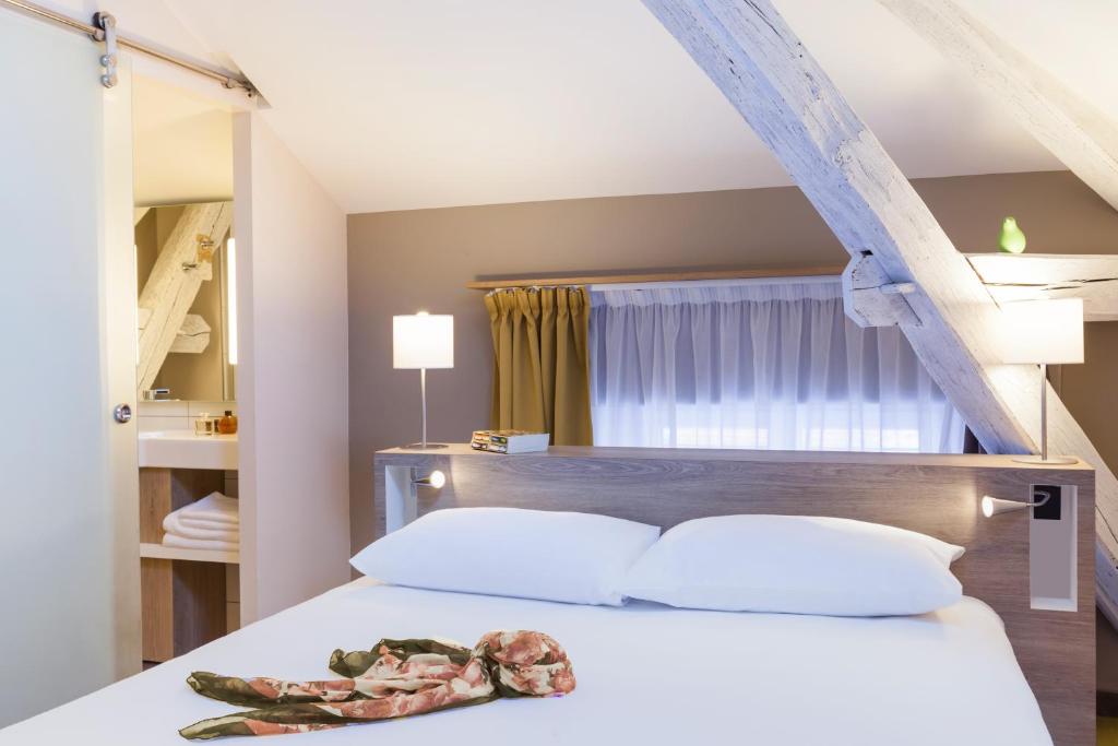 Postel nebo postele na pokoji v ubytování ibis Styles Chaumont Centre Gare