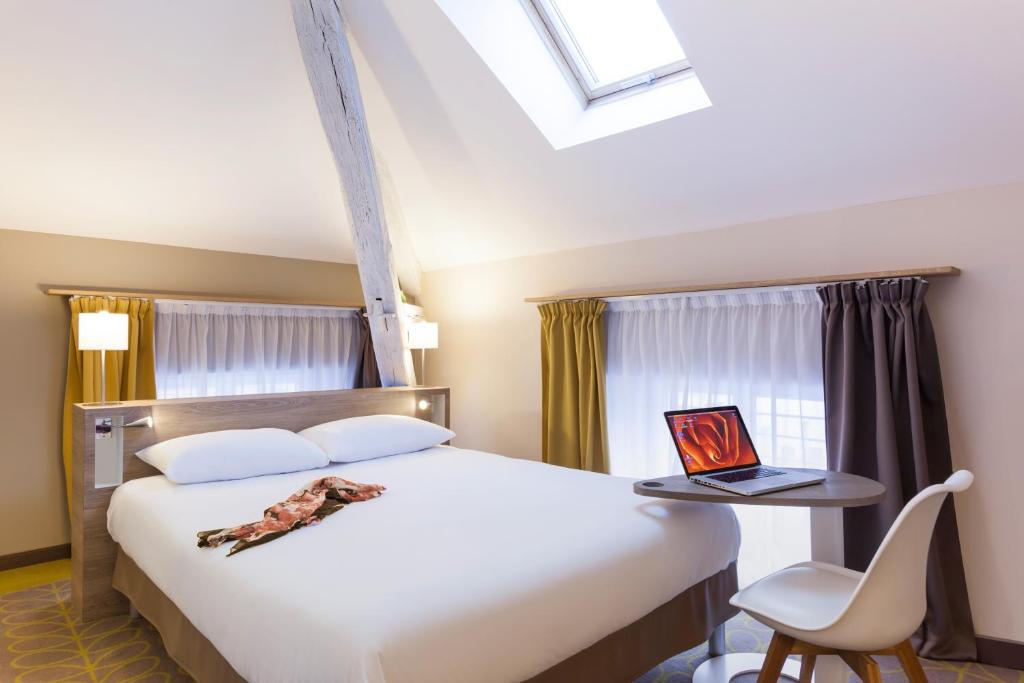 Postel nebo postele na pokoji v ubytování ibis Styles Chaumont Centre Gare