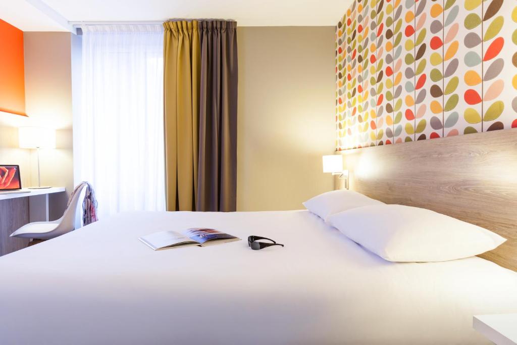 Postel nebo postele na pokoji v ubytování ibis Styles Chaumont Centre Gare
