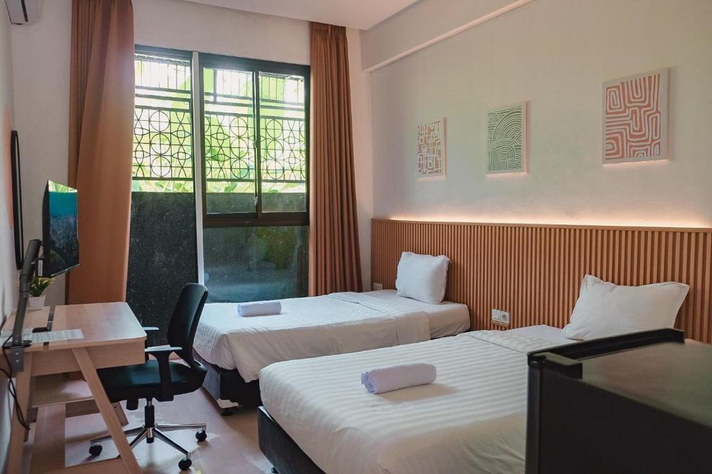 Postel nebo postele na pokoji v ubytování Olivia SOHO Guest House
