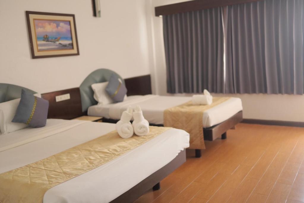 Letto o letti in una camera di Tanyong Hotel
