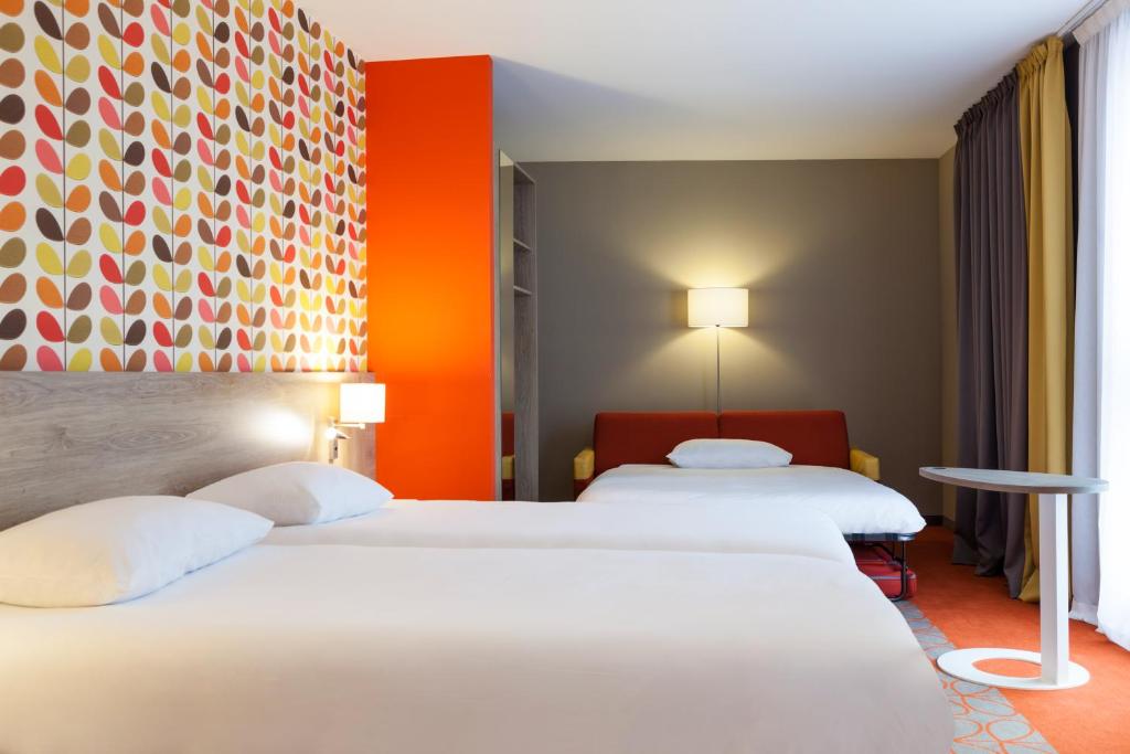 Postel nebo postele na pokoji v ubytování ibis Styles Chaumont Centre Gare
