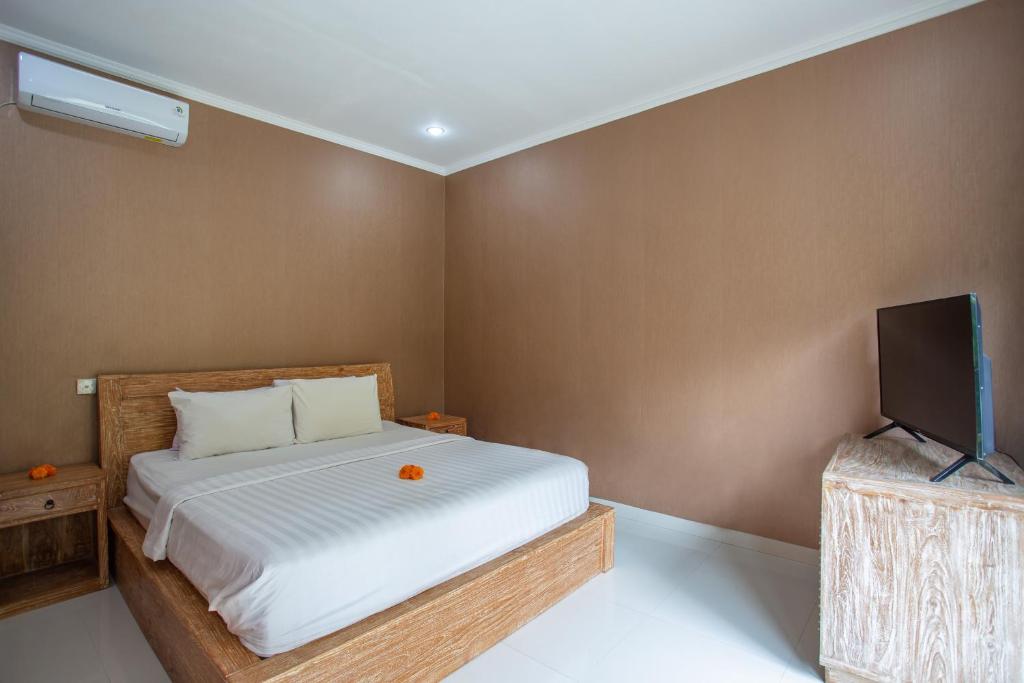 Postel nebo postele na pokoji v ubytování The Lavana Kubu Beji Villa Batubulan Gianyar