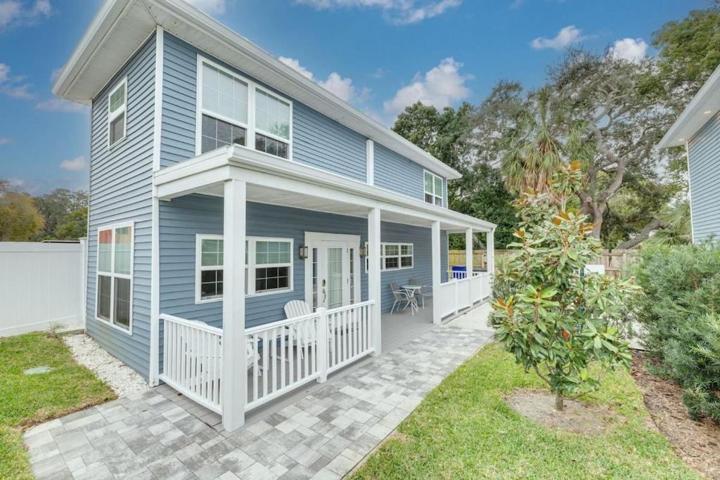 a blue house with a white porch at 719 Douglas Avenue, Unit D "Skye" in Dunedin