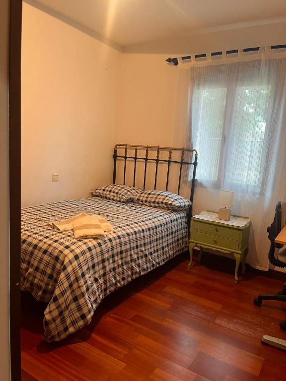 En eller flere senge i et værelse på Carmen Horcajo