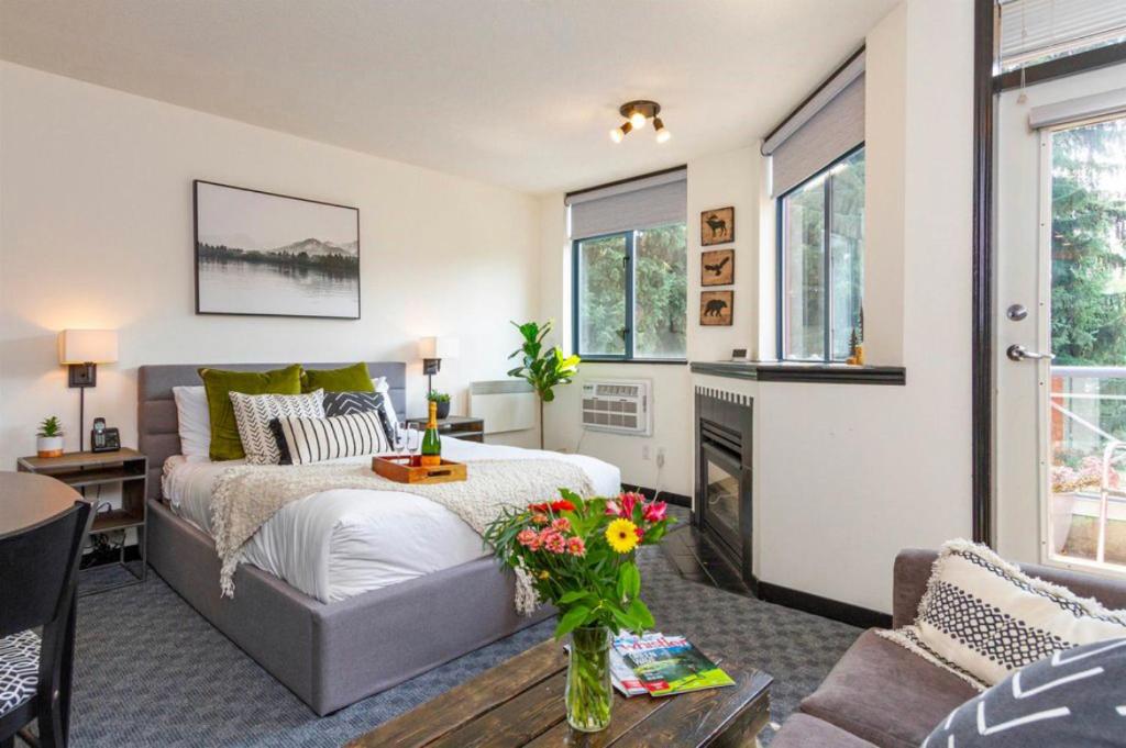 a bedroom with a bed and a living room at Ideal Central Village Location! in Whistler