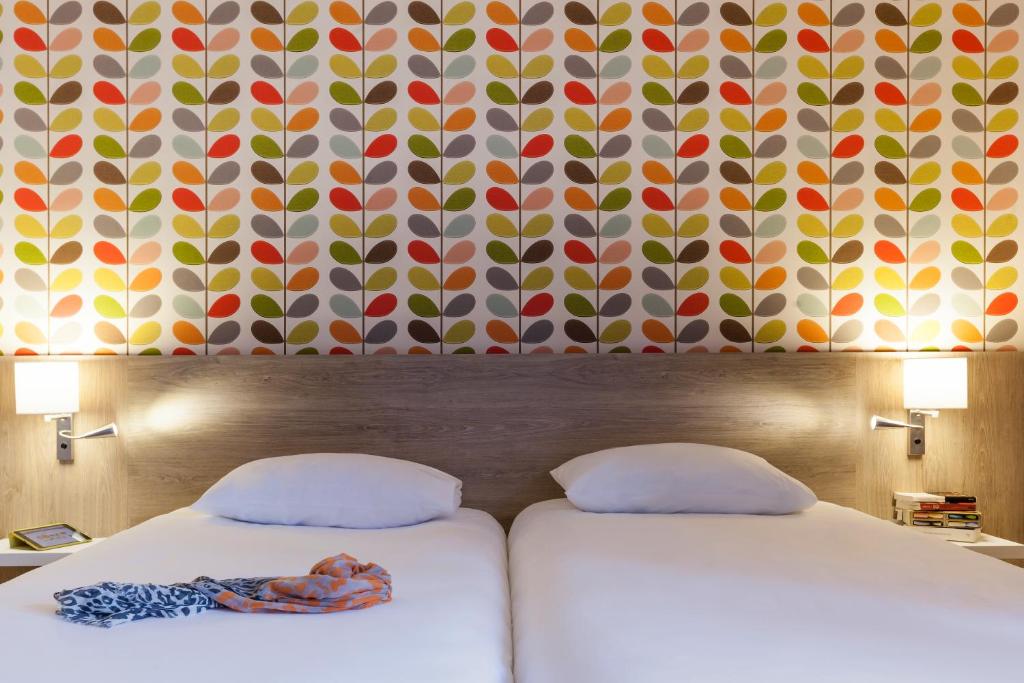 Postel nebo postele na pokoji v ubytování ibis Styles Chaumont Centre Gare