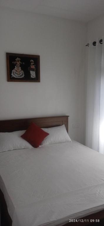 Ένα ή περισσότερα κρεβάτια σε δωμάτιο στο Sureka home stay