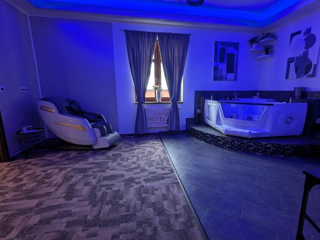 Łóżko lub łóżka w pokoju w obiekcie Wellness Hotel Beethoven