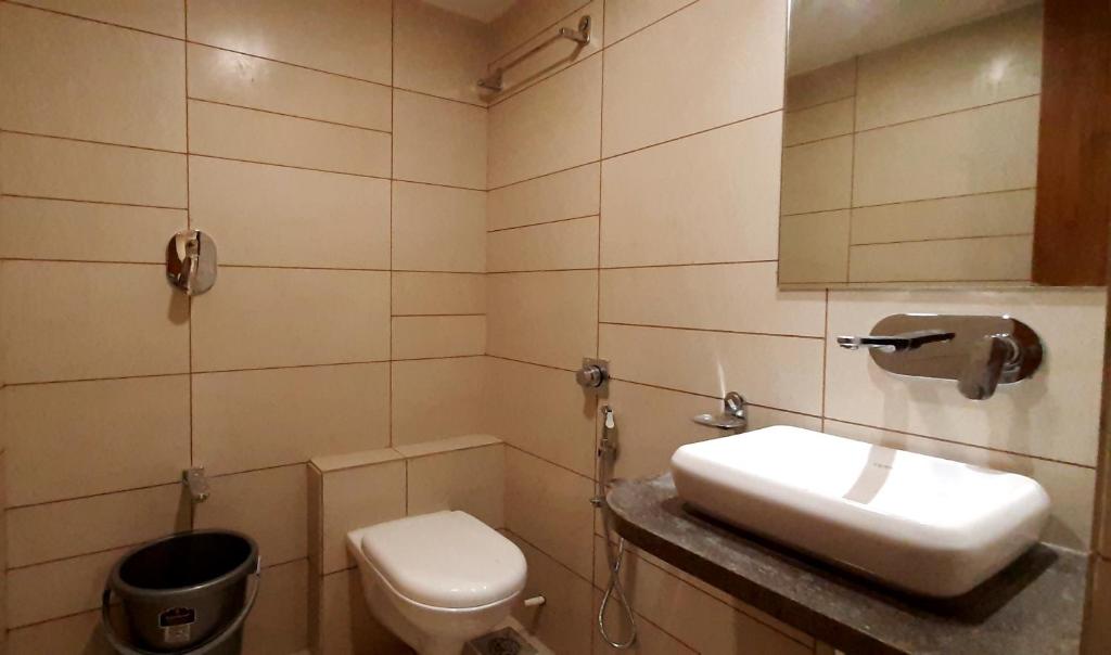 Koupelna v ubytování Hotel Kinara