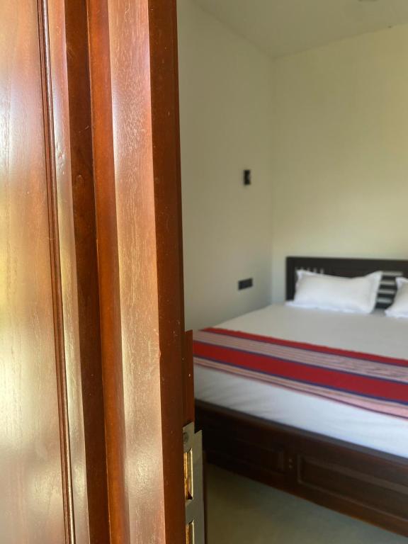 Postel nebo postele na pokoji v ubytování 7 Day Resort