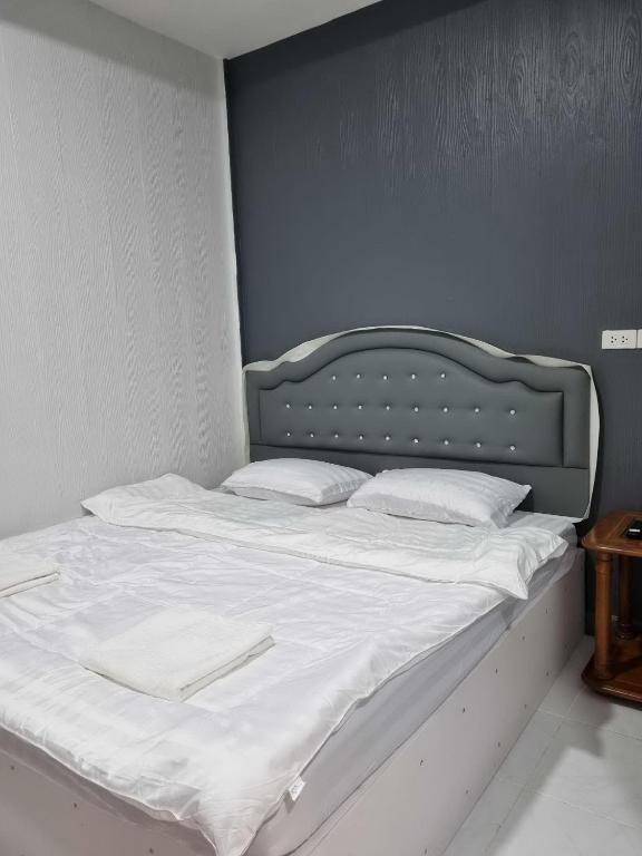 Postel nebo postele na pokoji v ubytování ฟ้ารีสอร์ต FAH Resort