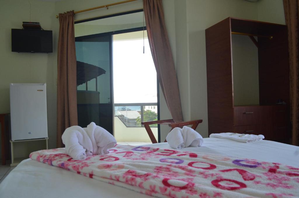 Postel nebo postele na pokoji v ubytování Hostal Andry