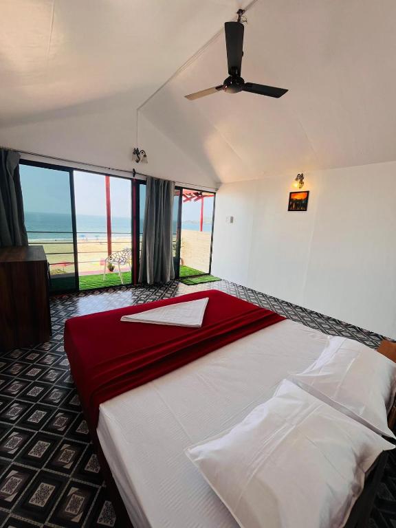 Postel nebo postele na pokoji v ubytování Casa Beach hut Resort