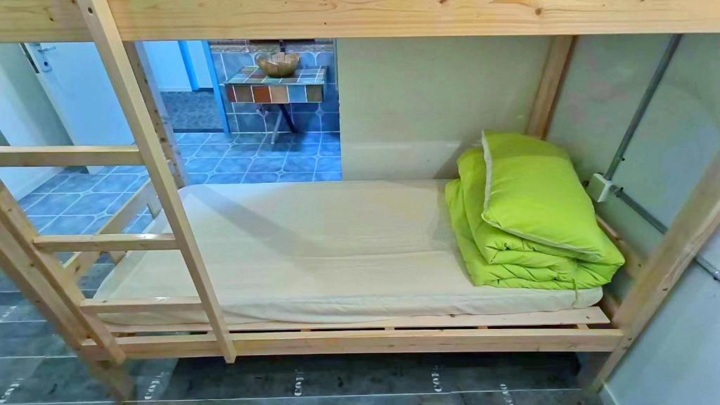 Postel nebo postele na pokoji v ubytování Qiannuo Youth Hostel