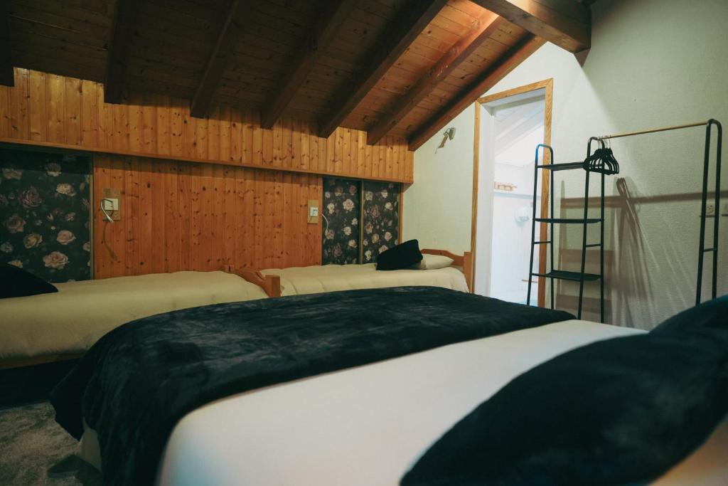 Postel nebo postele na pokoji v ubytování Auberge chez Mado et Augusta