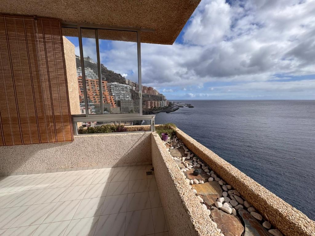a building with a view of the water at Alquilaencanarias Tabaiba vista mar in Tabaiba