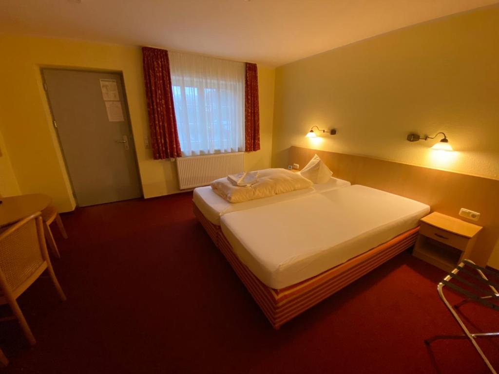 Voodi või voodid majutusasutuse Hotel Weidenmühle toas