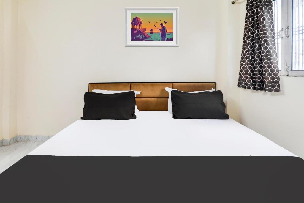 Postel nebo postele na pokoji v ubytování Hotel O Ramam