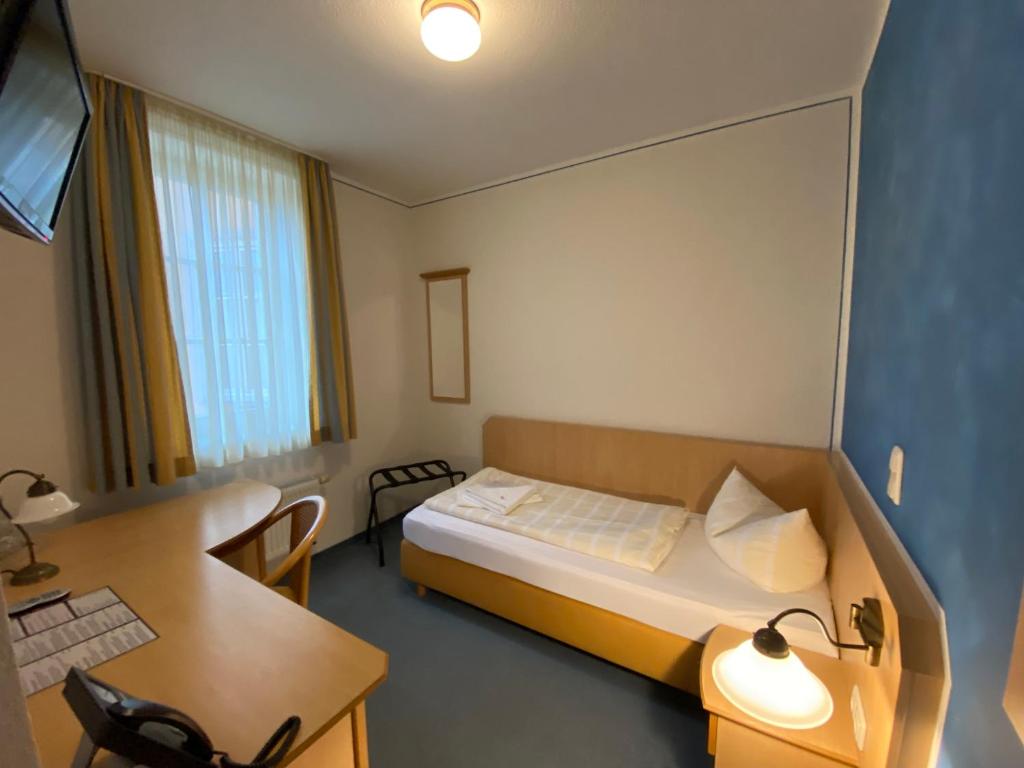 Voodi või voodid majutusasutuse Hotel Weidenmühle toas