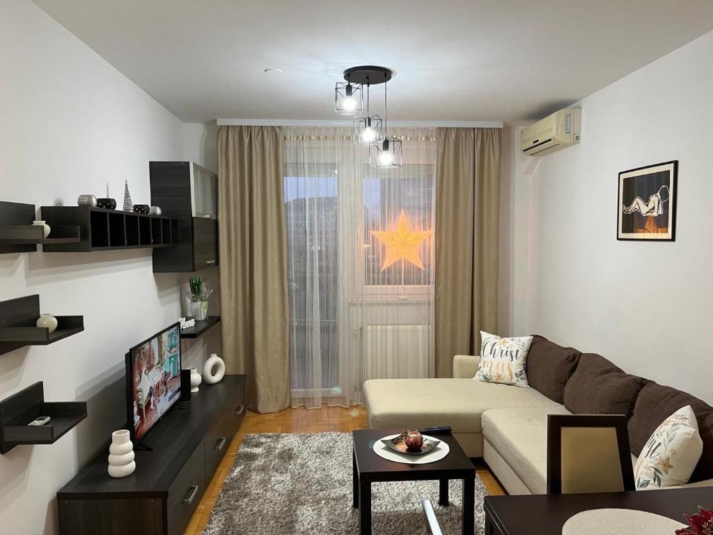 a living room with a couch and a table at Apartman KIKA in Banja Luka