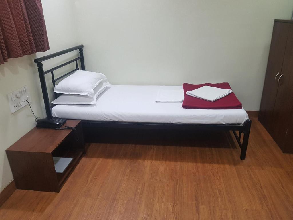 Postel nebo postele na pokoji v ubytování Hotel Kumkum