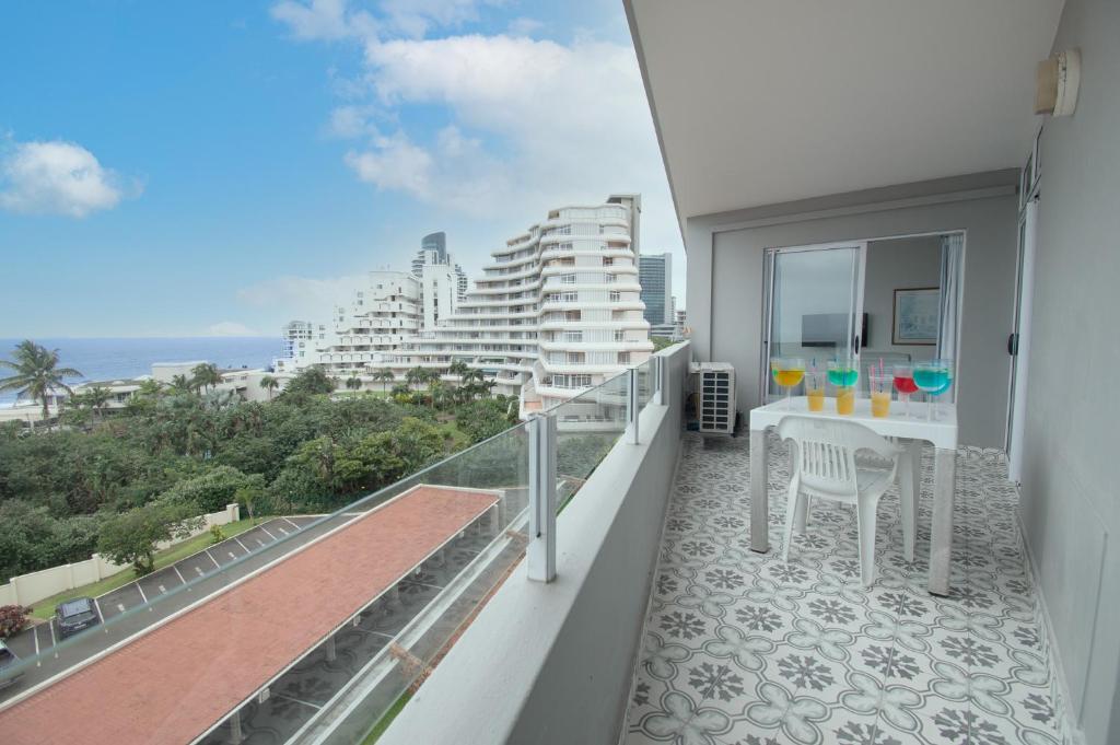 a balcony with a view of a building at 45 Sea Lodge Umhlanga Rocks in Durban