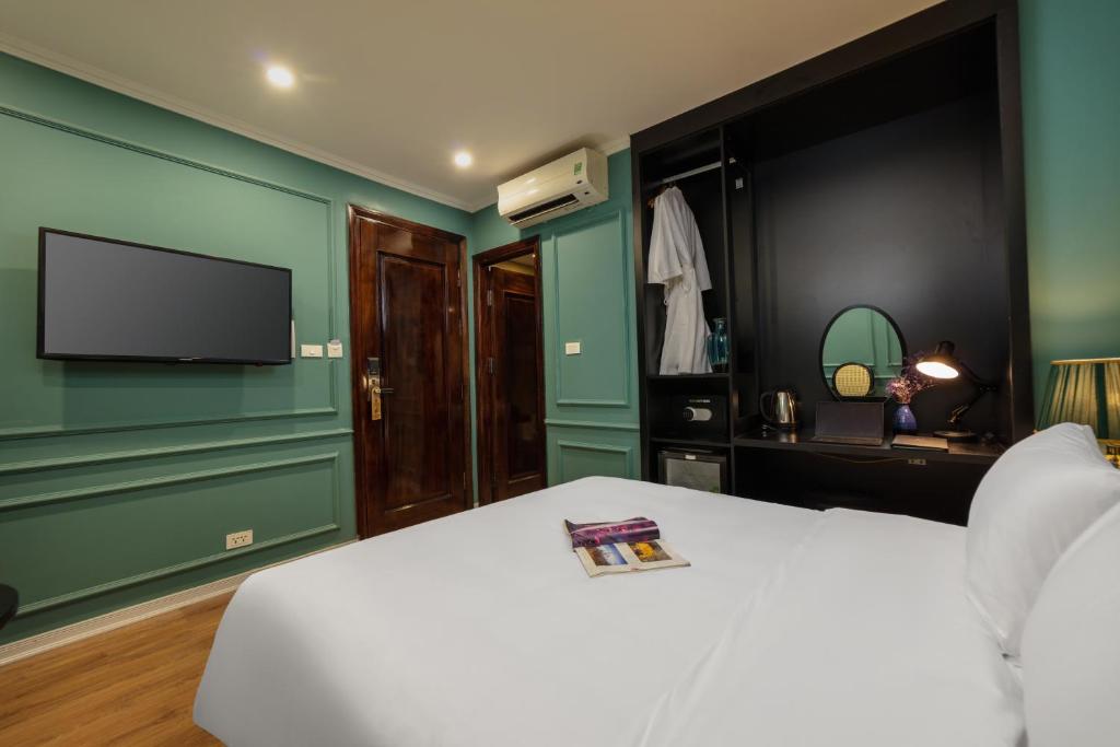 TV a/nebo společenská místnost v ubytování Hanoi Grand Hotel and Travel