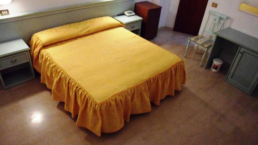 Postel nebo postele na pokoji v ubytování Hotel Reali