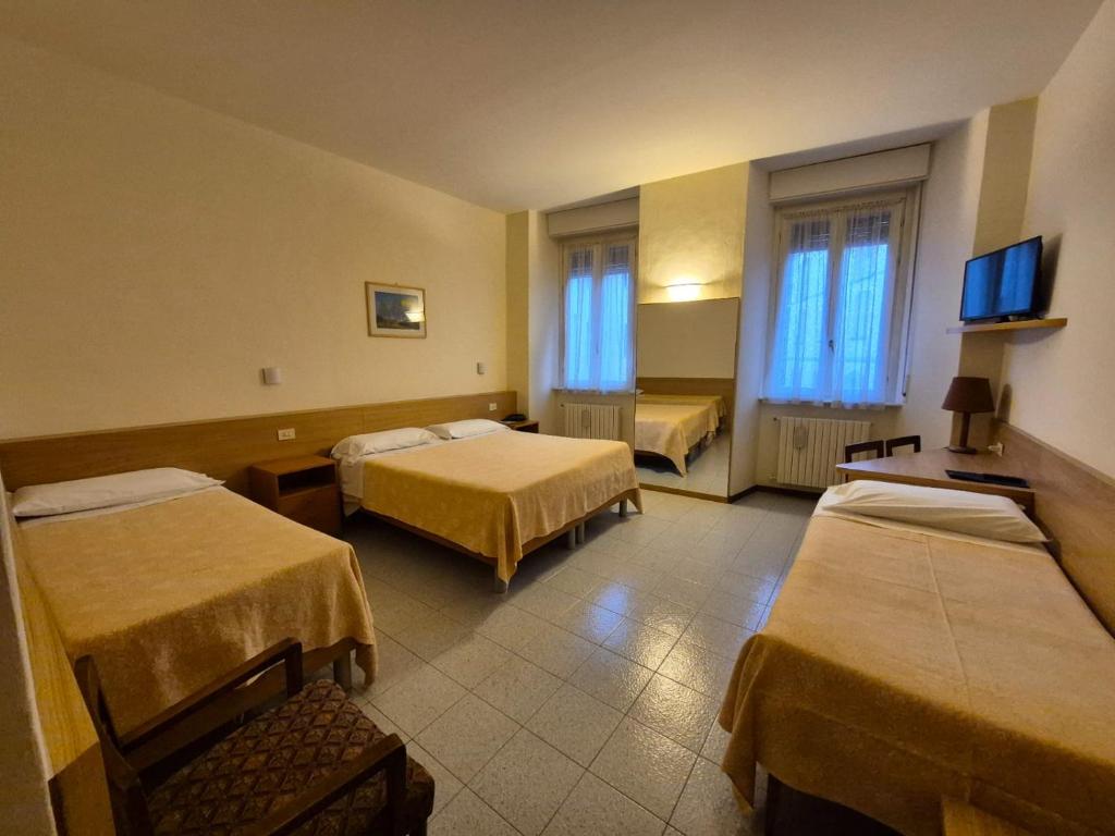 Postel nebo postele na pokoji v ubytování Hotel Tre Re