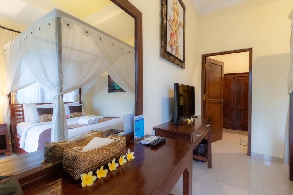 Postel nebo postele na pokoji v ubytování Doni House & Villas
