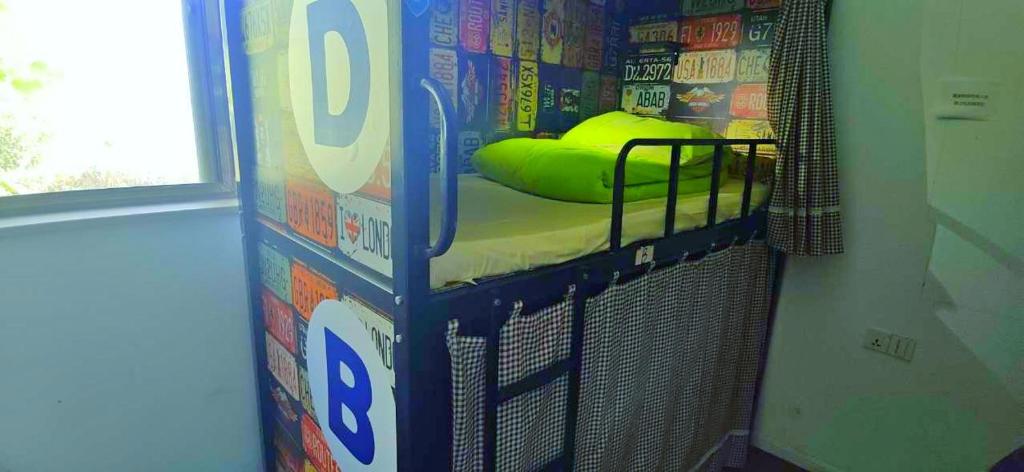 Postel nebo postele na pokoji v ubytování Qiannuo Youth Hostel