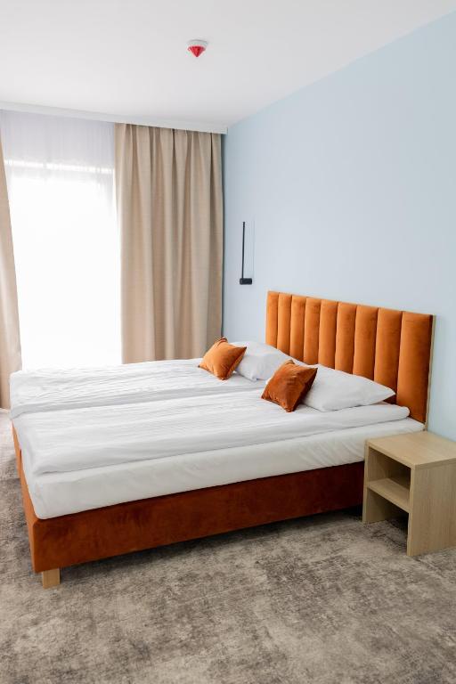 Postel nebo postele na pokoji v ubytování Plaża Resort Łeba & Wellness