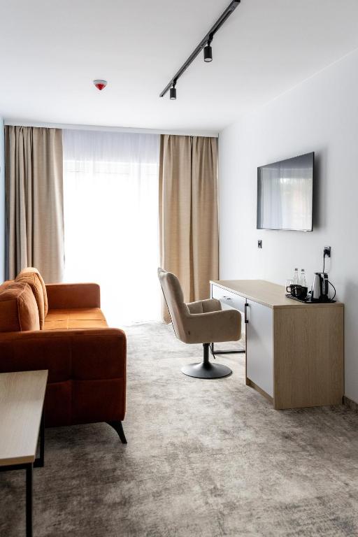 TV a/nebo společenská místnost v ubytování Plaża Resort Łeba & Wellness