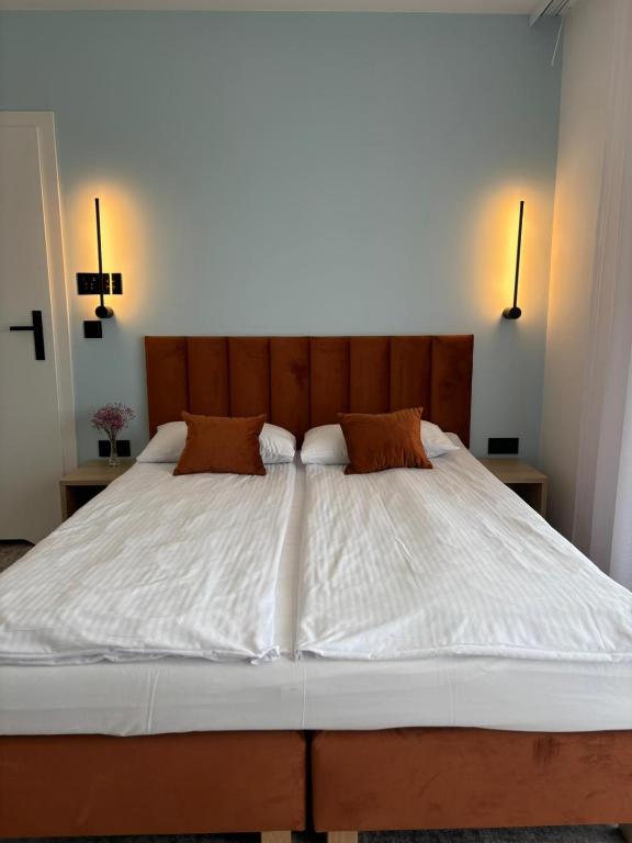 Postel nebo postele na pokoji v ubytování Plaża Resort Łeba & Wellness