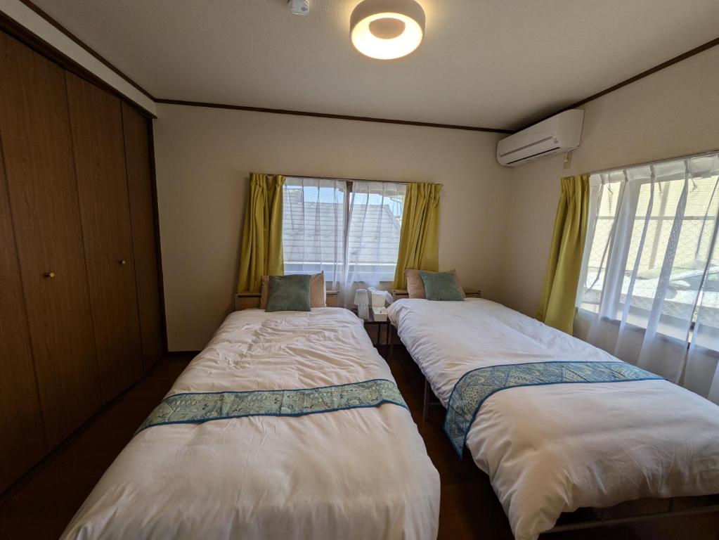 Postel nebo postele na pokoji v ubytování Villa Ishiyamadera ヴィラ 石山寺