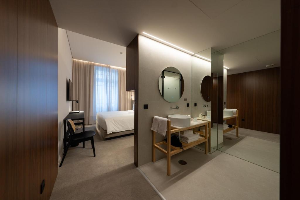 Postel nebo postele na pokoji v ubytování Templo Hotel & SPA