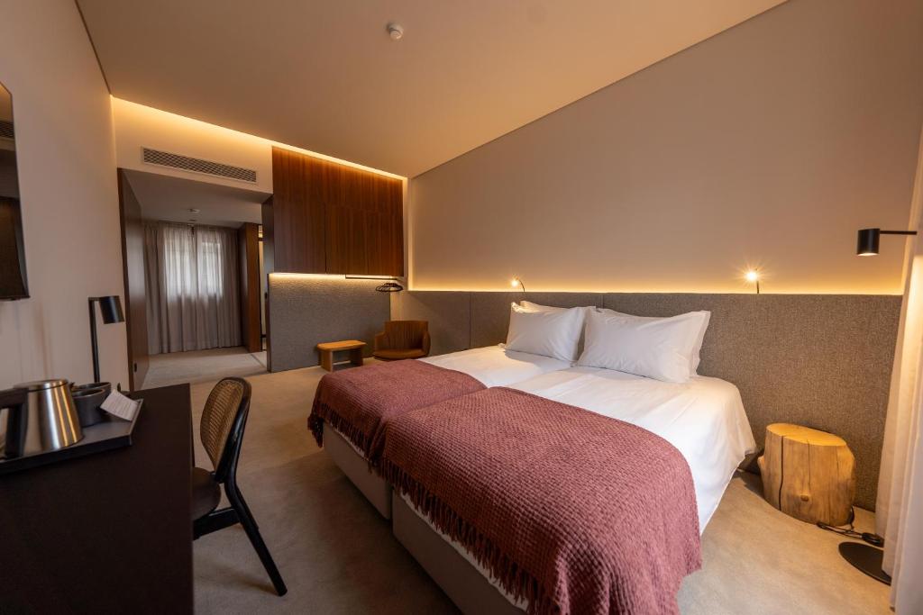 Postel nebo postele na pokoji v ubytování Templo Hotel & SPA