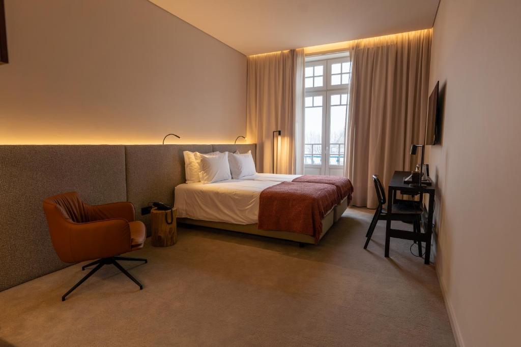 Postel nebo postele na pokoji v ubytování Templo Hotel & SPA