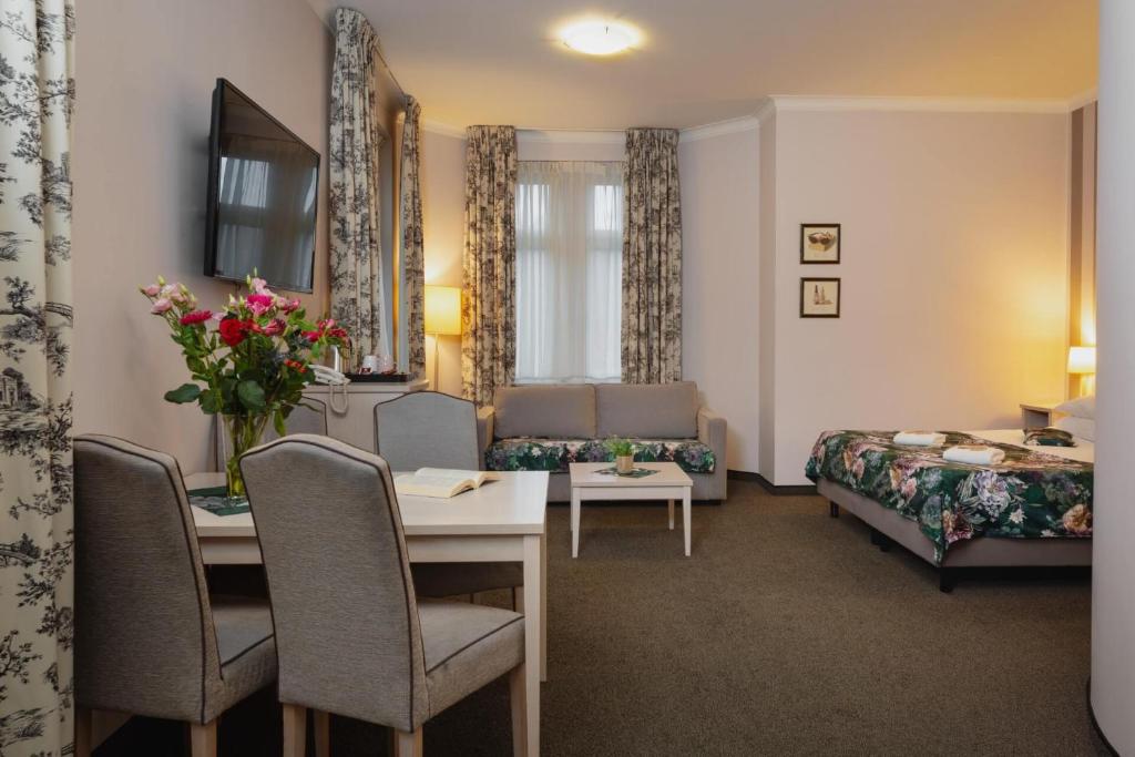 Postel nebo postele na pokoji v ubytování Hotel Amalia