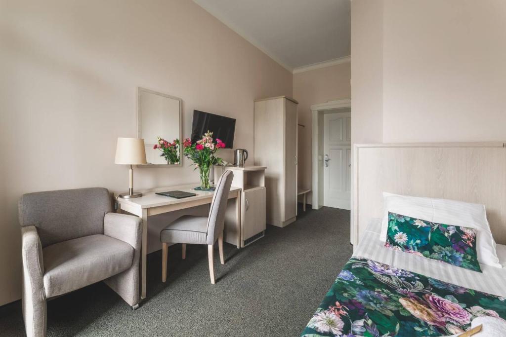 TV a/nebo společenská místnost v ubytování Hotel Amalia
