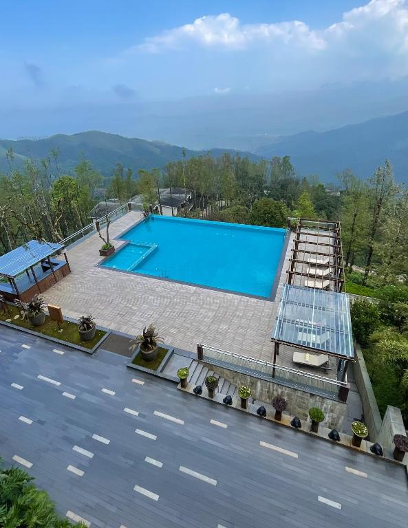 Bazén v ubytování Trivik Hotels & Resorts, Chikmagalur nebo v jeho okolí