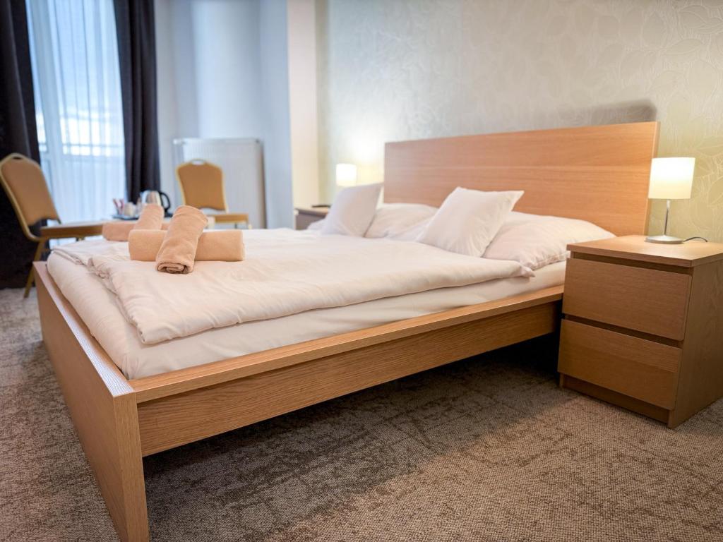 Postel nebo postele na pokoji v ubytování Hotel Modena