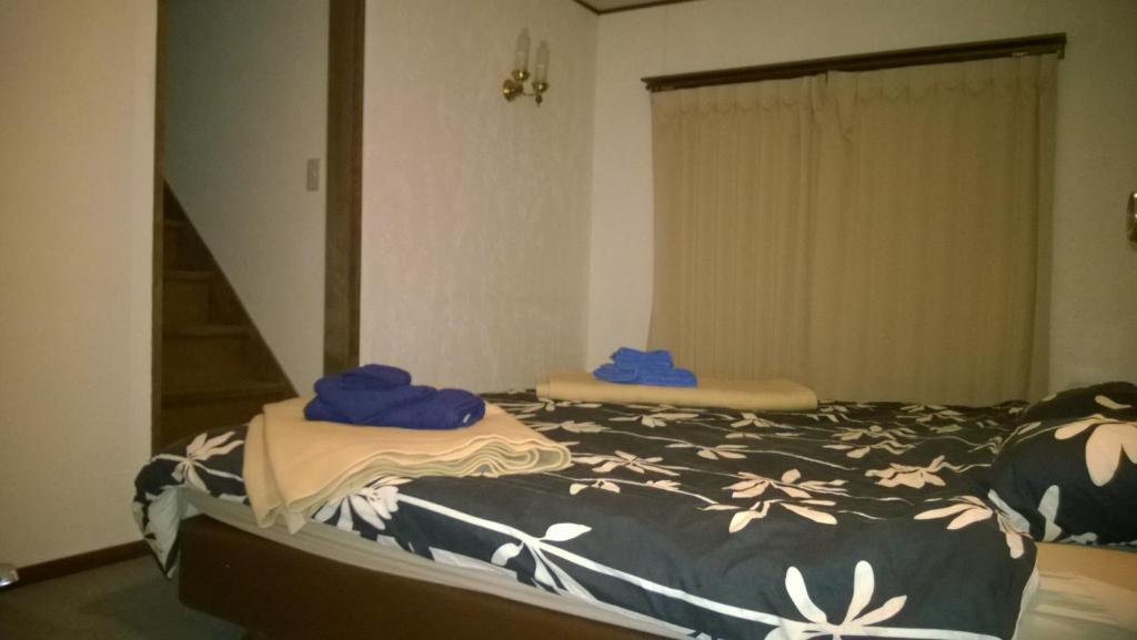Postel nebo postele na pokoji v ubytování Chalet Myoko