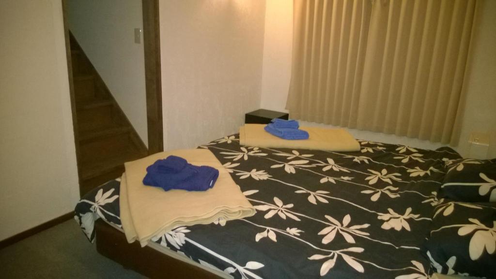 Postel nebo postele na pokoji v ubytování Chalet Myoko