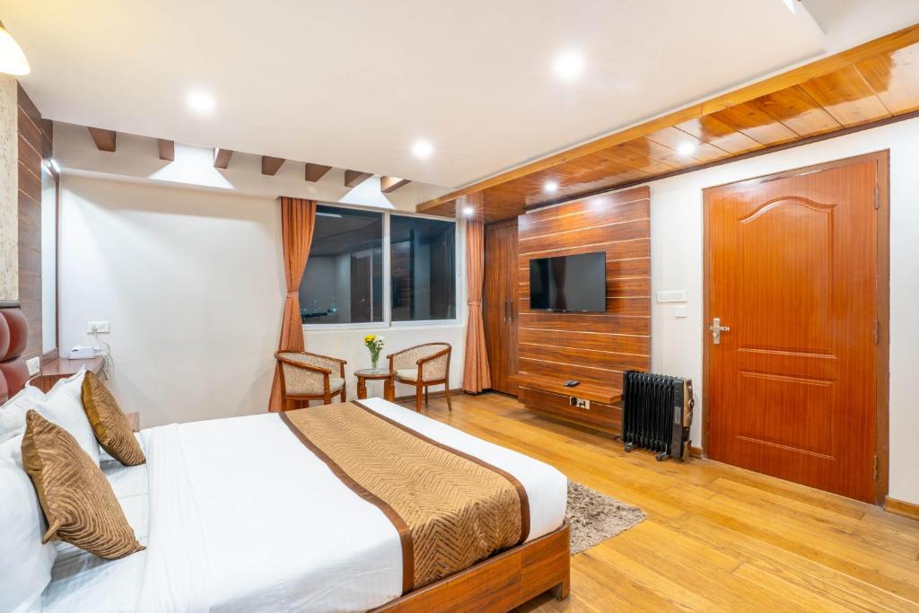 Postel nebo postele na pokoji v ubytování Jai Hotels