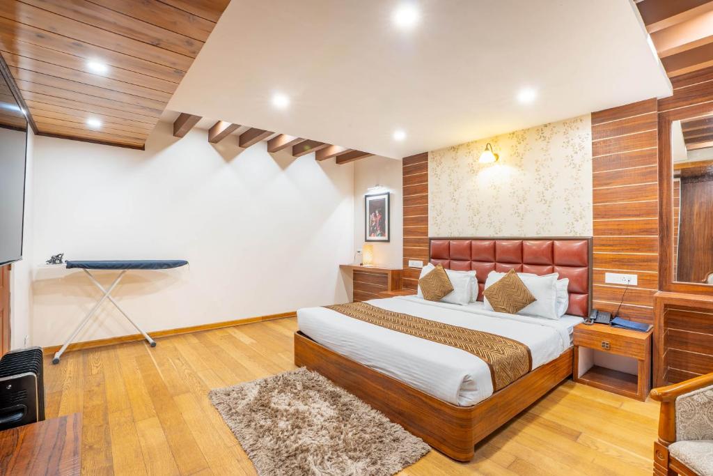 Postel nebo postele na pokoji v ubytování Jai Hotels