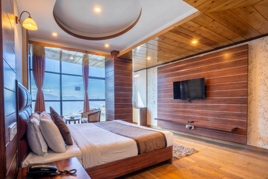 TV a/nebo společenská místnost v ubytování Jai Hotels