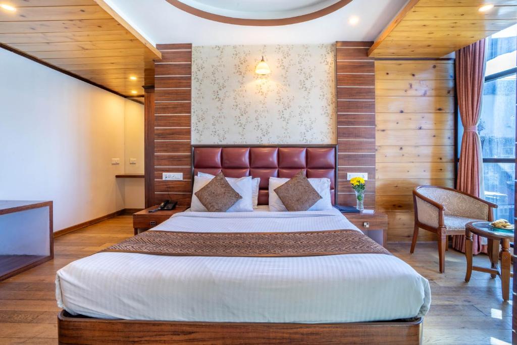 Postel nebo postele na pokoji v ubytování Jai Hotels