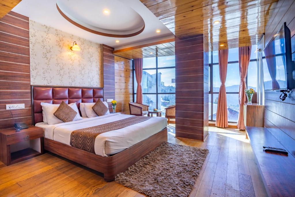 Postel nebo postele na pokoji v ubytování Jai Hotels